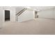 Expansive basement with neutral carpet and bar area, offering ample space for entertainment or recreation at 2056 S Ogden St, Denver, CO 80210