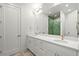 This bathroom features dual sinks, quartz countertops, and modern fixtures, offering a spa-like experience at 2056 S Ogden St, Denver, CO 80210