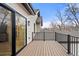 Stunning outdoor deck features sleek black railings and wood flooring, perfect for entertaining with a view at 2056 S Ogden St, Denver, CO 80210