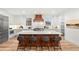 Elegant kitchen with large island, stainless appliances, hardwood floors, and eat in seating at 2056 S Ogden St, Denver, CO 80210