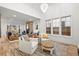Bright, open-concept living room with hardwood floors and ample seating at 2056 S Ogden St, Denver, CO 80210