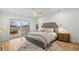 Bright main bedroom with access to a private balcony, hardwood floors, and neutral decor at 2056 S Ogden St, Denver, CO 80210