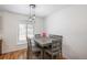 Dining area with table and chairs near kitchen at 7933 York St # 1, Denver, CO 80229
