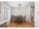 Dining area with table, chairs, and hardwood floors at 7933 York St # 1, Denver, CO 80229
