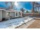 Ranch style home with gray siding, landscaped yard, and walkway at 7933 York St # 1, Denver, CO 80229