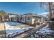 Ranch-style home with gray siding and landscaping at 7933 York St # 1, Denver, CO 80229