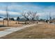 Park pathway with covered picnic areas at 7933 York St # 1, Denver, CO 80229
