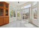 Sunlit breakfast nook featuring lots of natural light from the many windows and access to the yard at 14938 Clayton St, Thornton, CO 80602
