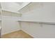 Walk-in closet featuring ample shelving and rod space for organized storage solutions at 14938 Clayton St, Thornton, CO 80602