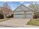 Inviting home featuring a three-car garage and a well-maintained lawn in a desirable neighborhood at 14938 Clayton St, Thornton, CO 80602