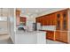 Modern kitchen with granite countertops, stainless steel appliances, and custom cabinetry for ample storage at 14938 Clayton St, Thornton, CO 80602