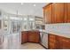 Stylish kitchen with stainless steel appliances, granite countertops, and easy access to outdoor living at 14938 Clayton St, Thornton, CO 80602