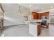 Open concept living and dining space, with modern appliances and lots of light at 14938 Clayton St, Thornton, CO 80602