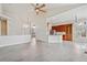 Bright, open-concept living space featuring stylish flooring and seamless transitions to other areas of the home at 14938 Clayton St, Thornton, CO 80602