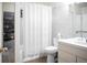 Bathroom with a shower-tub combination, white tile, and vanity with mirror at 1257 Quitman St, Denver, CO 80204