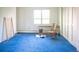 Empty bedroom with blue carpet, a window, and a closet at 1257 Quitman St, Denver, CO 80204