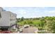 Exterior shot of apartment building with a view of landscaping and parking area at 1257 Quitman St, Denver, CO 80204