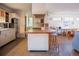 Spacious kitchen featuring a wooden breakfast bar, white cabinets, and ample countertop space at 1257 Quitman St, Denver, CO 80204