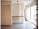 Open-concept living area with tiled floors, closet, and sliding glass doors leading to the outside at 1257 Quitman St, Denver, CO 80204