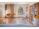 Hardwood floors and arched window complement the living room at 1257 Quitman St, Denver, CO 80204