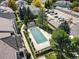 Aerial view of the community pool, garages, and surrounding neighborhood, highlighting amenities at 5745 W Atlantic Pl # 108, Lakewood, CO 80227