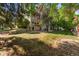 Spacious backyard with lush greenery and mature trees, creating a serene outdoor environment at 5745 W Atlantic Pl # 108, Lakewood, CO 80227