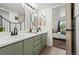 Stylish bathroom featuring double sinks, new fixtures, and decorative wallpaper at 5745 W Atlantic Pl # 108, Lakewood, CO 80227
