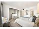 Bright bedroom features an open closet, fresh paint, and a cozy sitting area for relaxation at 5745 W Atlantic Pl # 108, Lakewood, CO 80227