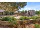 Community courtyard featuring a seating area surrounded by greenery and attractive landscaping at 5745 W Atlantic Pl # 108, Lakewood, CO 80227