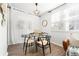 Bright dining area with modern table set and natural light from the large windows at 5745 W Atlantic Pl # 108, Lakewood, CO 80227