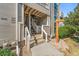 Inviting entrance with stairs leading to upper units, showcasing well-maintained exterior and landscape at 5745 W Atlantic Pl # 108, Lakewood, CO 80227