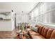 Inviting living room with dining area, showcasing wood floors and bright natural lighting at 5745 W Atlantic Pl # 108, Lakewood, CO 80227