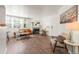 Cozy living room featuring a fireplace, wood floors, comfortable seating and natural light at 5745 W Atlantic Pl # 108, Lakewood, CO 80227