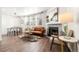 Bright living room featuring a fireplace, wood floors, and comfortable seating at 5745 W Atlantic Pl # 108, Lakewood, CO 80227