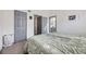 Bedroom with multiple gray accent doors and bright natural light at 3010 W Prentice Ave # J, Littleton, CO 80123
