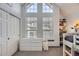 Bedroom featuring vaulted ceiling with large windows and a closet with sliding doors at 3010 W Prentice Ave # J, Littleton, CO 80123