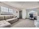 Upstairs bonus room with a large sectional couch, desk and a comfortable work area at 3010 W Prentice Ave # J, Littleton, CO 80123