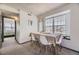 Bright dining room featuring a large window and modern light fixture at 3010 W Prentice Ave # J, Littleton, CO 80123