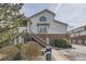 Inviting townhome featuring well-maintained landscaping, stairs to unit entry, and convenient parking at 3010 W Prentice Ave # J, Littleton, CO 80123