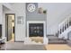 Cozy fireplace with tile surround, and access to the lower level and updated bathroom at 3010 W Prentice Ave # J, Littleton, CO 80123