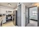 Efficient kitchen layout with stainless steel appliances and gray accent doors at 3010 W Prentice Ave # J, Littleton, CO 80123