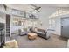Living area with neutral décor, vaulted ceiling, balcony and open floor plan, a cozy fireplace at 3010 W Prentice Ave # J, Littleton, CO 80123