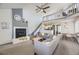 Bright living room with vaulted ceilings, cozy fireplace, and an open layout perfect for entertaining at 3010 W Prentice Ave # J, Littleton, CO 80123