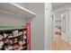 Hallway with shoe storage and a view into the bedroom at 12112 Melody Dr # 302, Denver, CO 80234