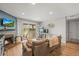 Comfortable living room with fireplace, sliding glass doors, and a workspace with desk and computer at 12112 Melody Dr # 302, Denver, CO 80234