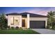 Modern single-story home boasting a spacious two-car garage, neutral color palette, and professionally landscaped lawn at 6368 Verve Ln, Parker, CO 80134