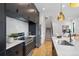 Elegant kitchen featuring stainless steel appliances, sleek countertops, and stylish fixtures, perfect for cooking and entertaining at 1250 Yates St, Denver, CO 80204
