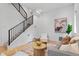 Comfortable living room with stylish decor, hardwood floors, and staircase, perfect for relaxation and entertaining at 1250 Yates St, Denver, CO 80204
