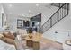 Modern living room with an open floor plan, hardwood floors, and lots of natural light at 1250 Yates St, Denver, CO 80204