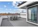 Rooftop deck featuring modern seating and panoramic neighborhood views at 1250 Yates St, Denver, CO 80204